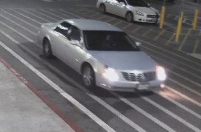 Suspect's silver Cadillac passenger car pictured from a Wal-Mart parking lot camera. 